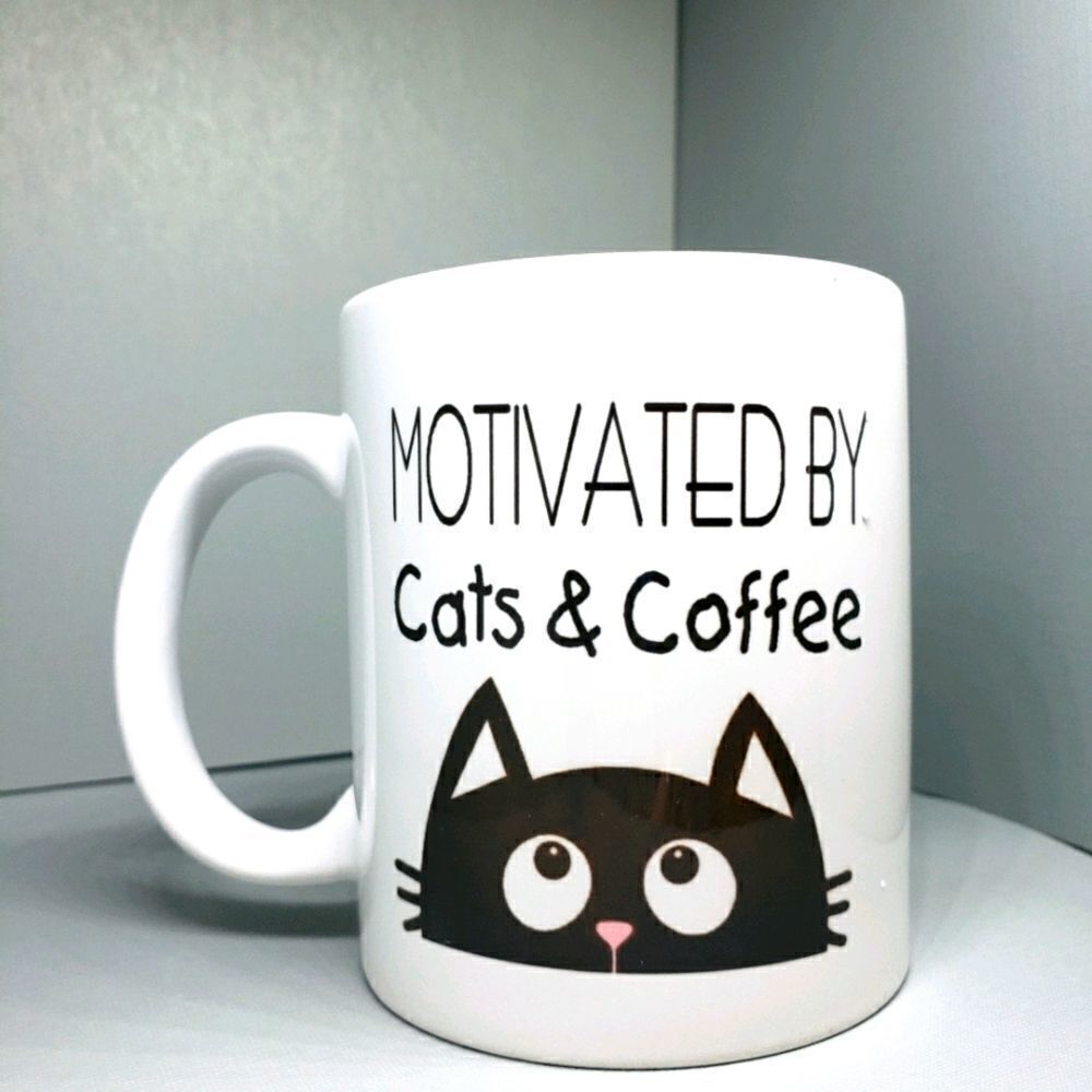 Motivated by cats and coffee,  mug